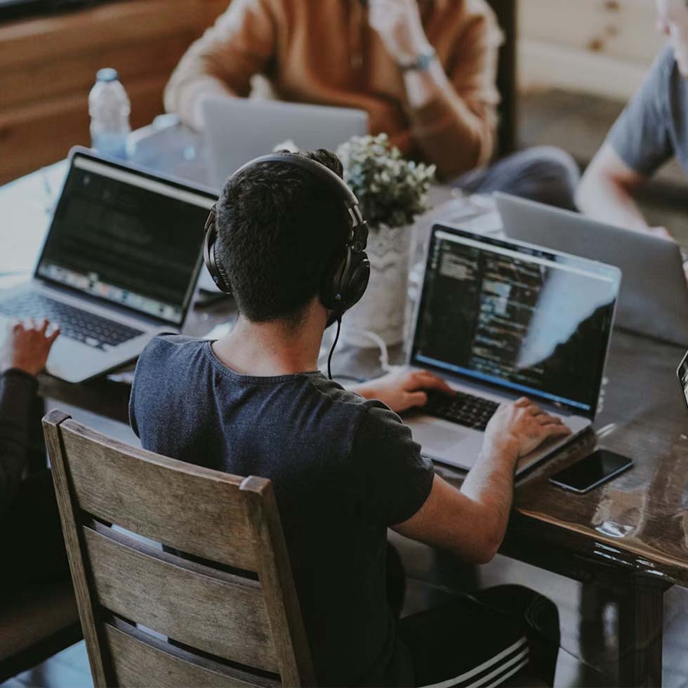 Software developers working collaboratively at desk