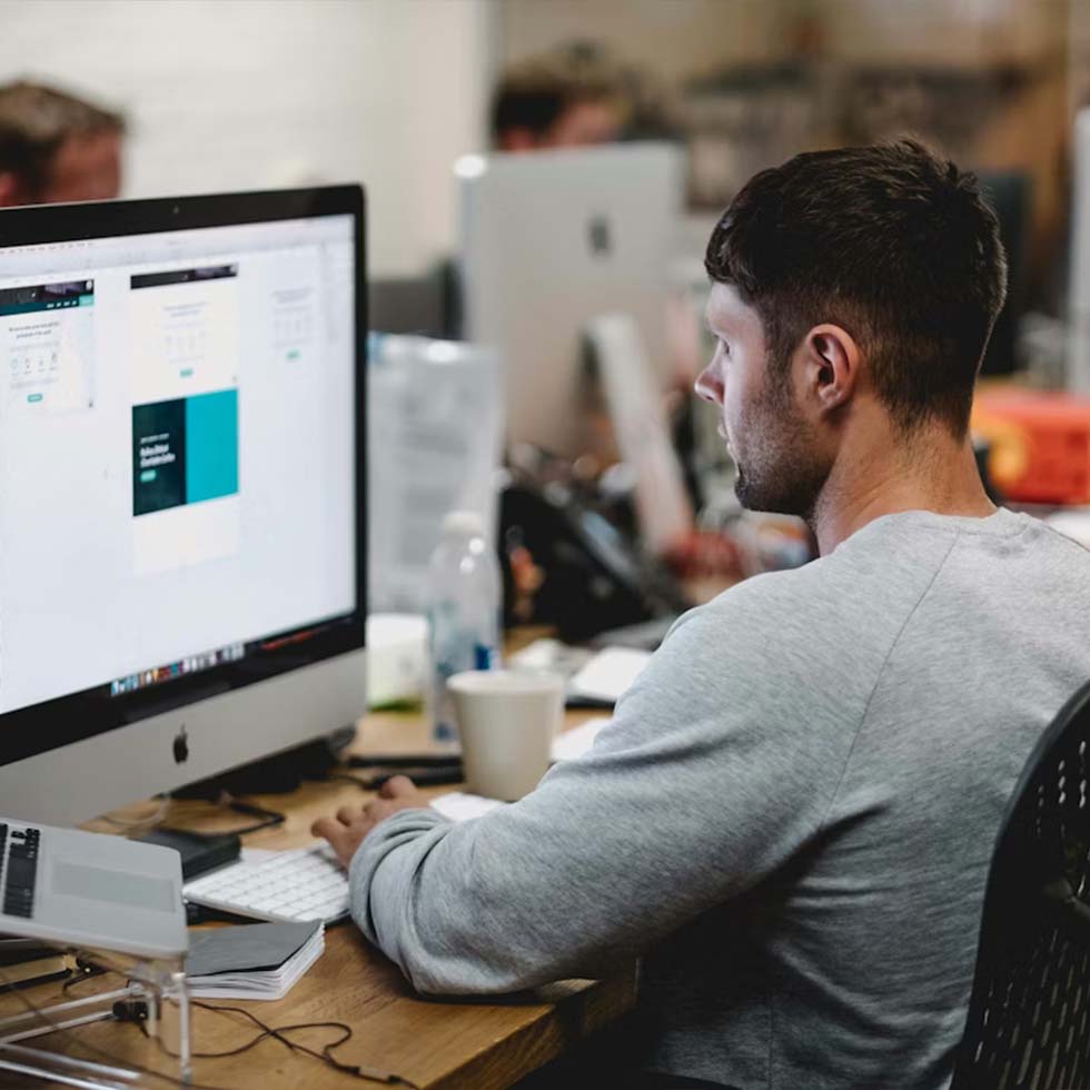 Software developer working on screen
